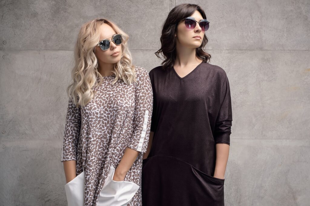 Two fashionable girls wearing sunglasses