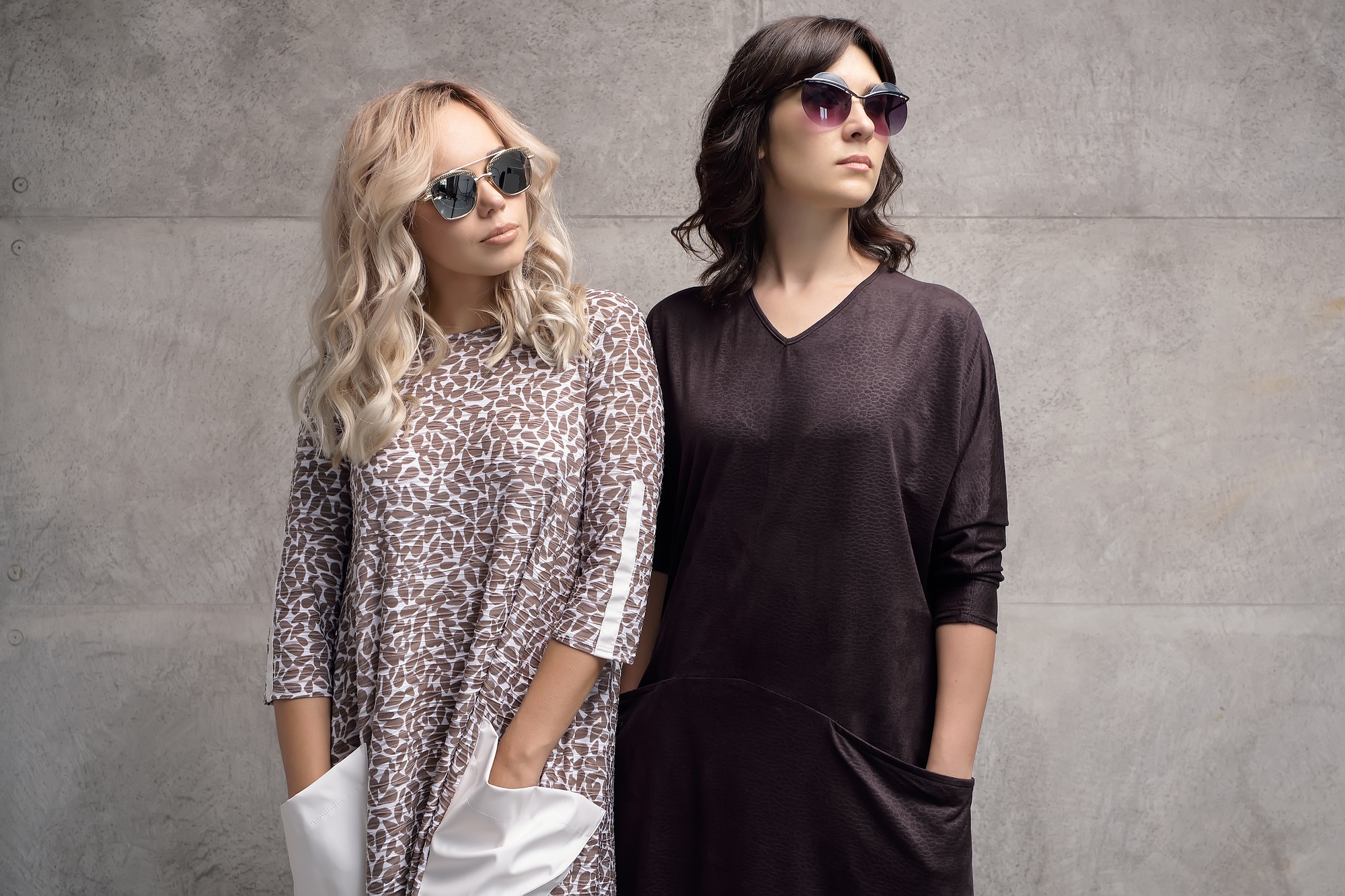Two fashionable girls wearing sunglasses